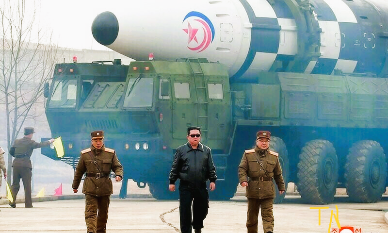 North Korean leader Kim Jong Un (C) walking near what state media report says a new type inter-continental ballistic missile file photo