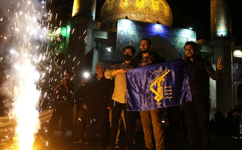 Iranians celebrate on a street, after the IRGC attack on Israel, in Tehran, Iran, April 14, 2024